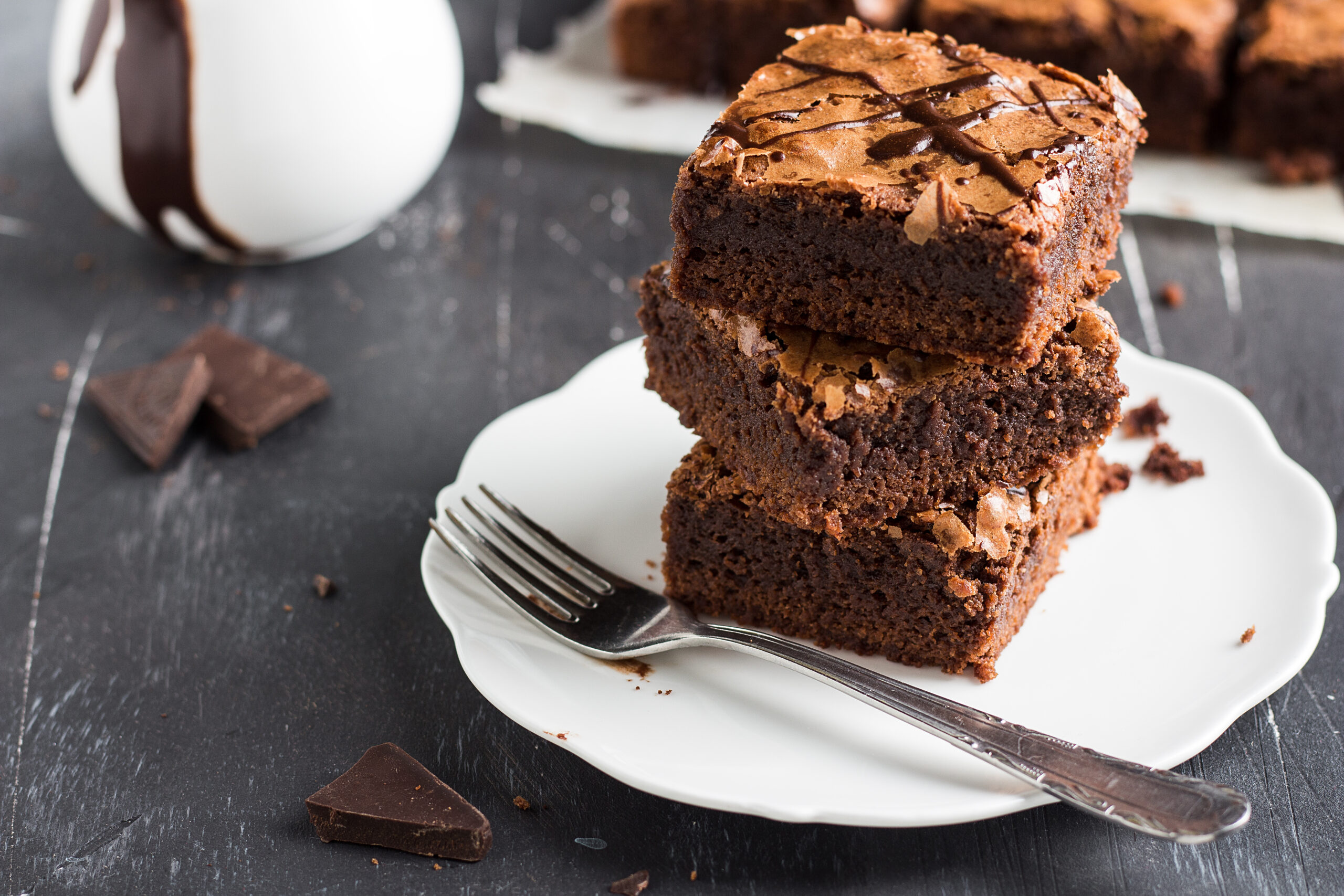 Chocolate brownie cake piece stack on plate homemade pastries