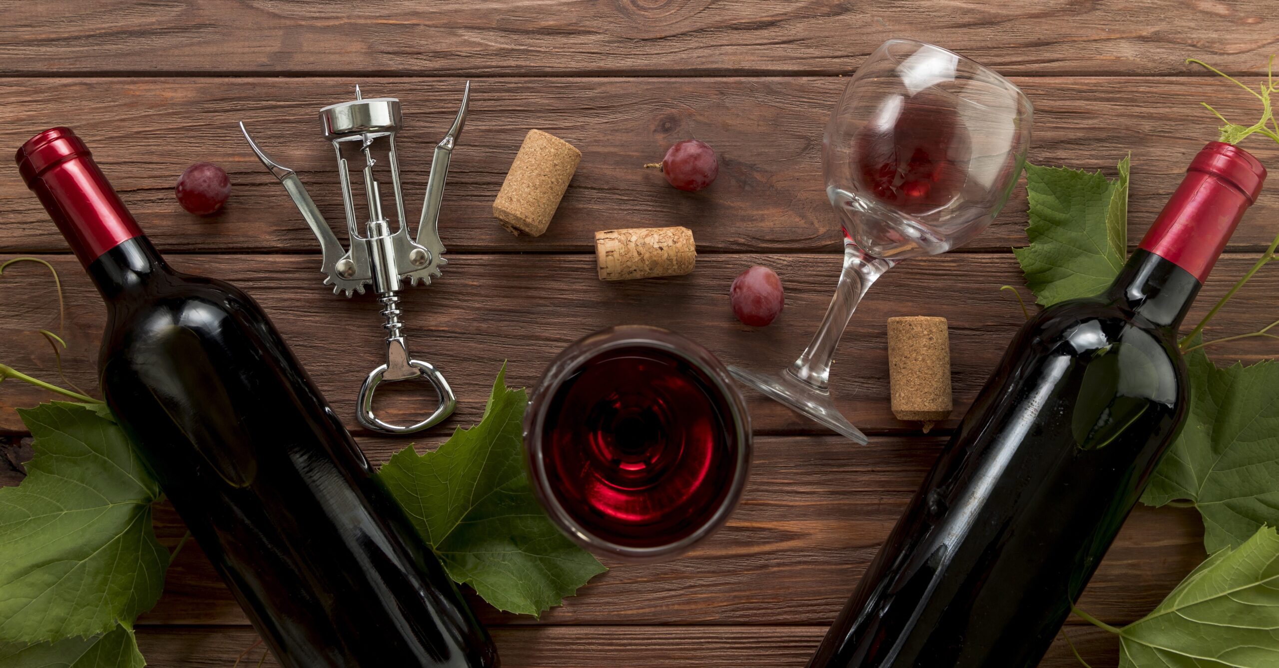 top-view-wine-bottles-wooden-background